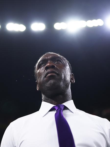 Clarence Seedorf em campo durante evento esportivo